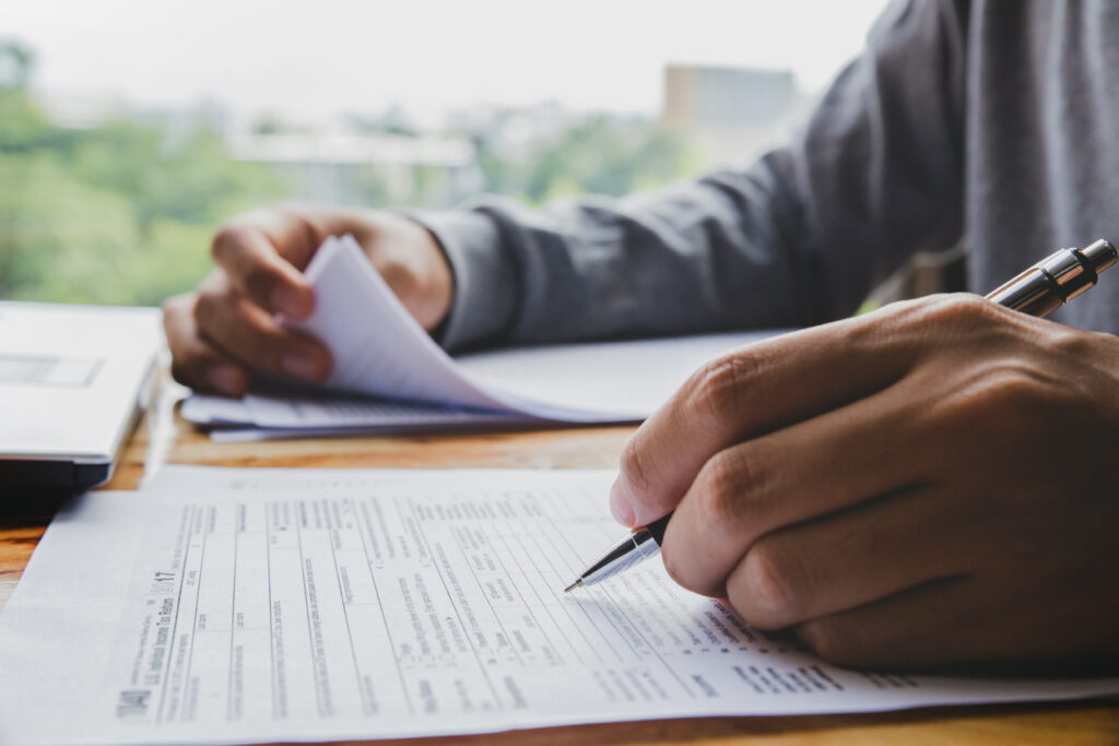 man filling in paperwork