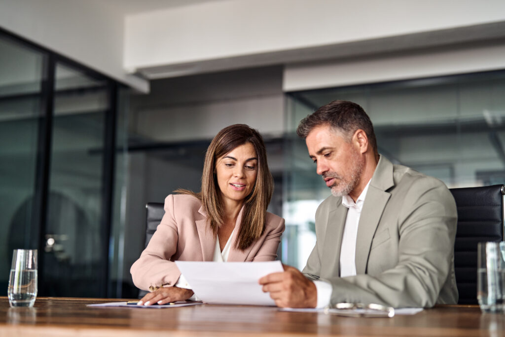 estate agent and landlord reviewing documents