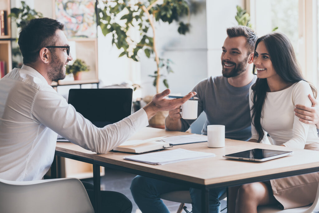 lettings agent and couple talking