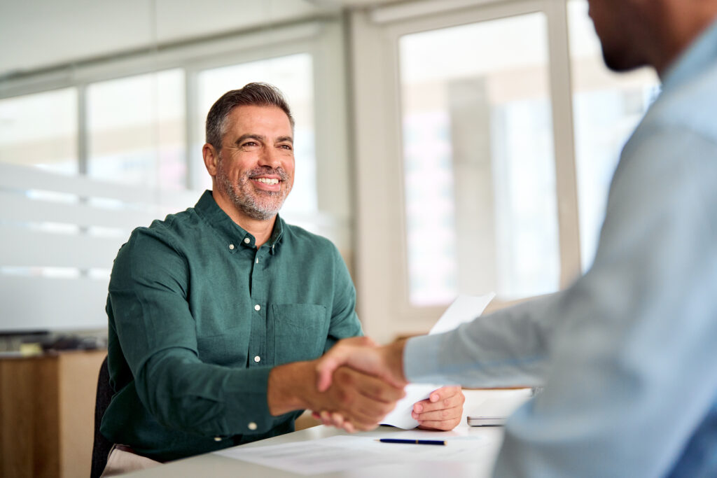 landlord shaking hand in meeting