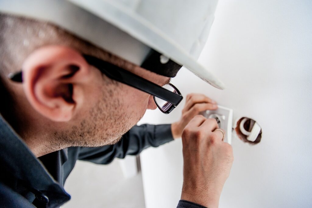 repair man fixing socket